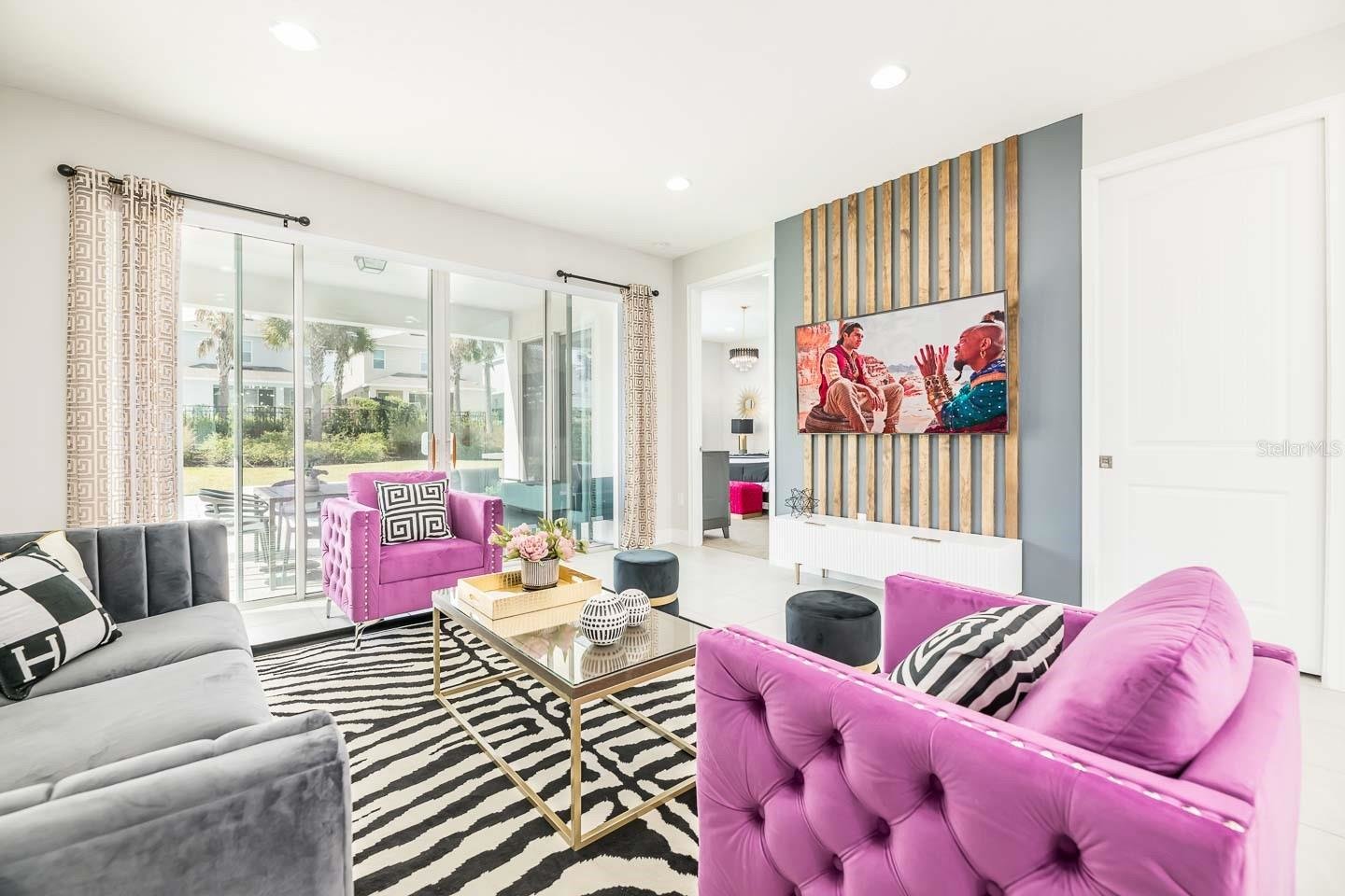 modern living room with gold and pink accents